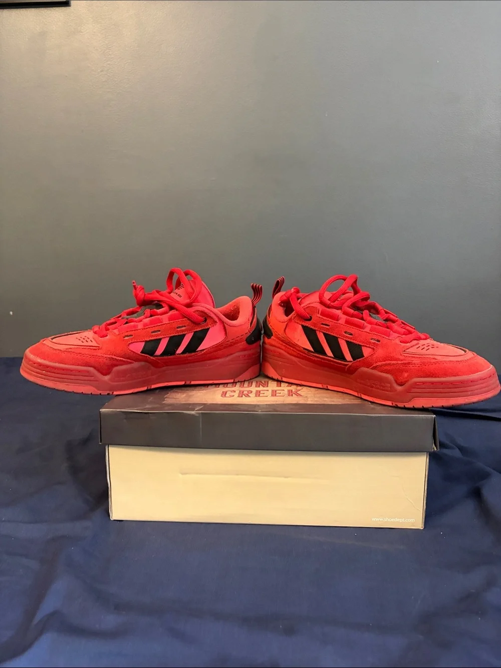 adidas Red Low-Top Sneakers with Black Stripes